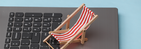 Illustration of a sun lounger on a laptop keyboard