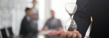 A man holding a hourglass